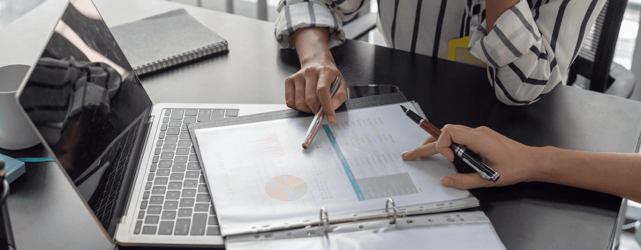 Sales team reviewing key account management strategy with charts and stakeholder maps